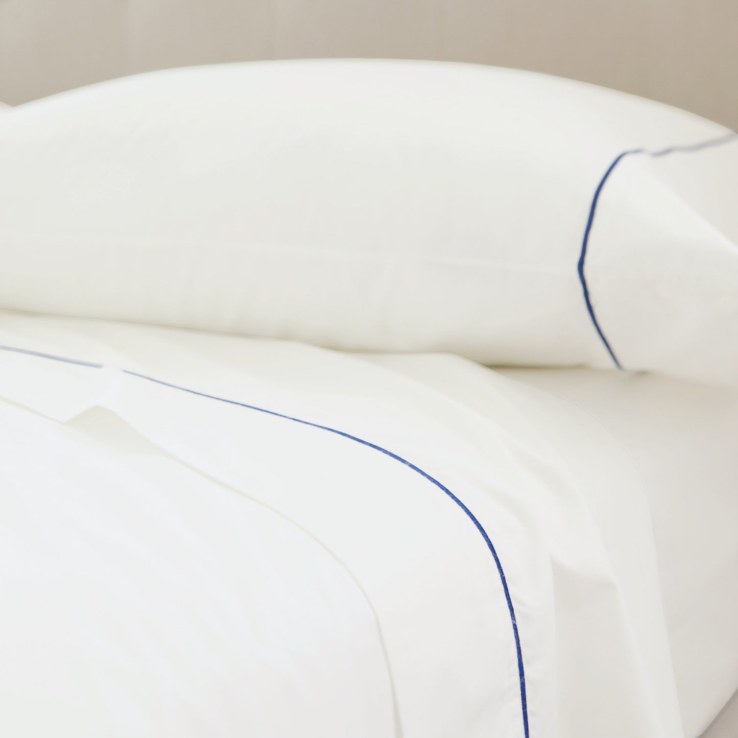 SlumberEmbroideredStripePercaleSheetSet_NavyWhite_Home_Lifestyle_3x4_Crop.jpg